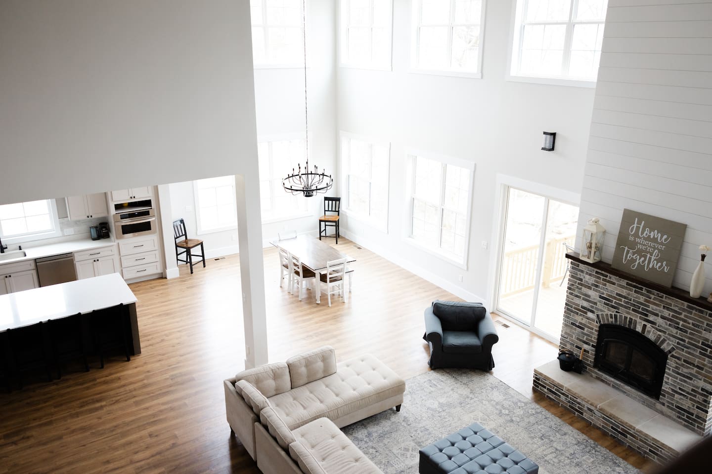 The view of the great room is breathtaking at both levels, with two stories of windows that provide gorgeous vistas in every season and in every type of weather. Snow and sun and thunderstorms alike are all a spectacle through these windows. 