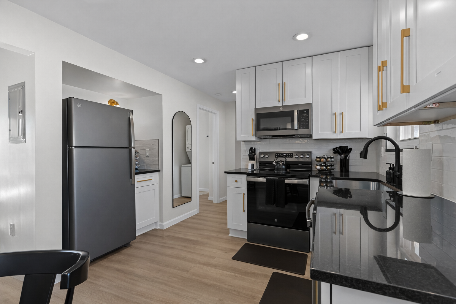 Sleek, fully equipped kitchen with modern appliances, ample counter space, and clean finishes—perfect for cooking, meal prep, or easy everyday dining.