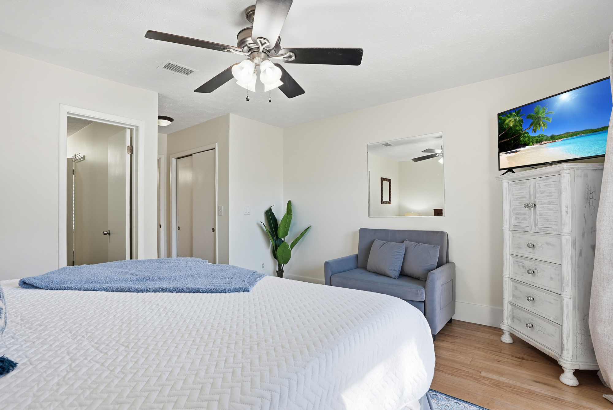 Bedroom # 2 is Downstairs with King Bed and Access to Backyard