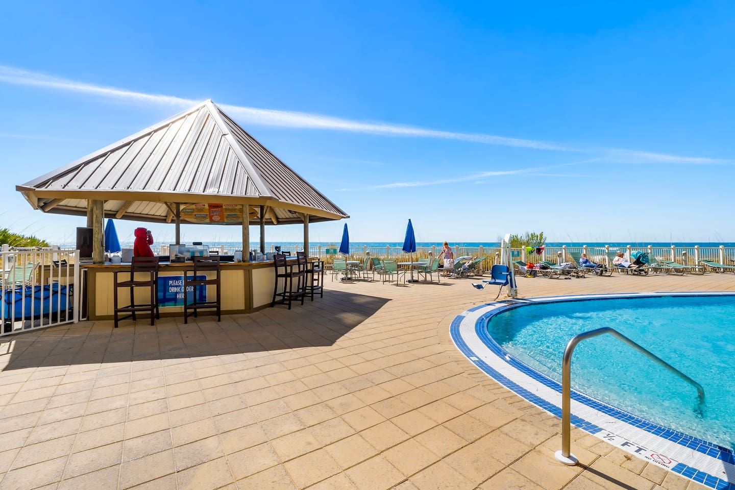 Grab a drink at the beachfront tiki bar and soak up the sun by the pool! Enjoy refreshing cocktails, ocean breezes, and unbeatable views—just steps from the sand.