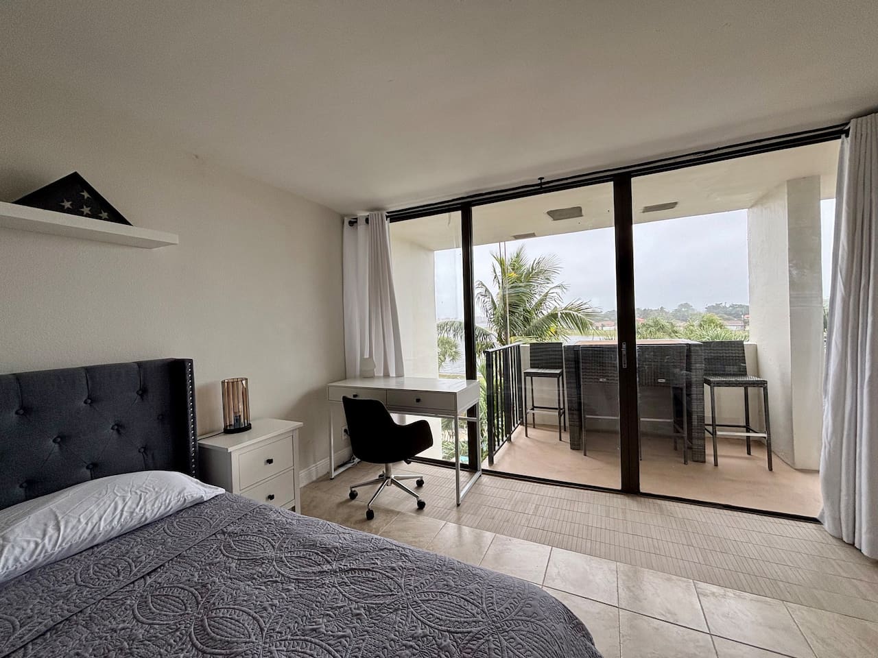 The bedroom also features a conveniently located workspace, where great views of the lake can be had.