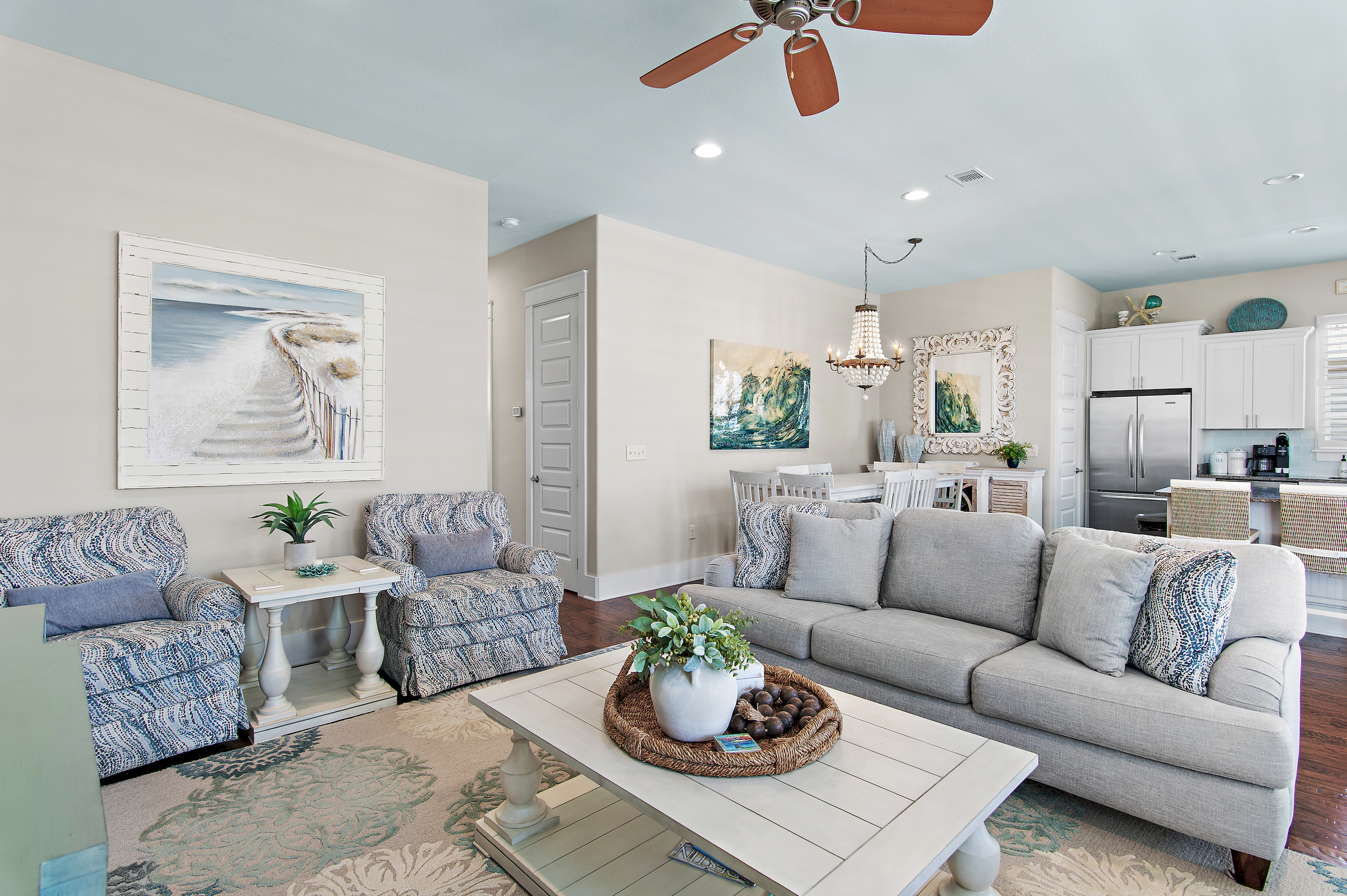 Relax in a bright, coastal-inspired living room designed for comfort after a day at the beach.
