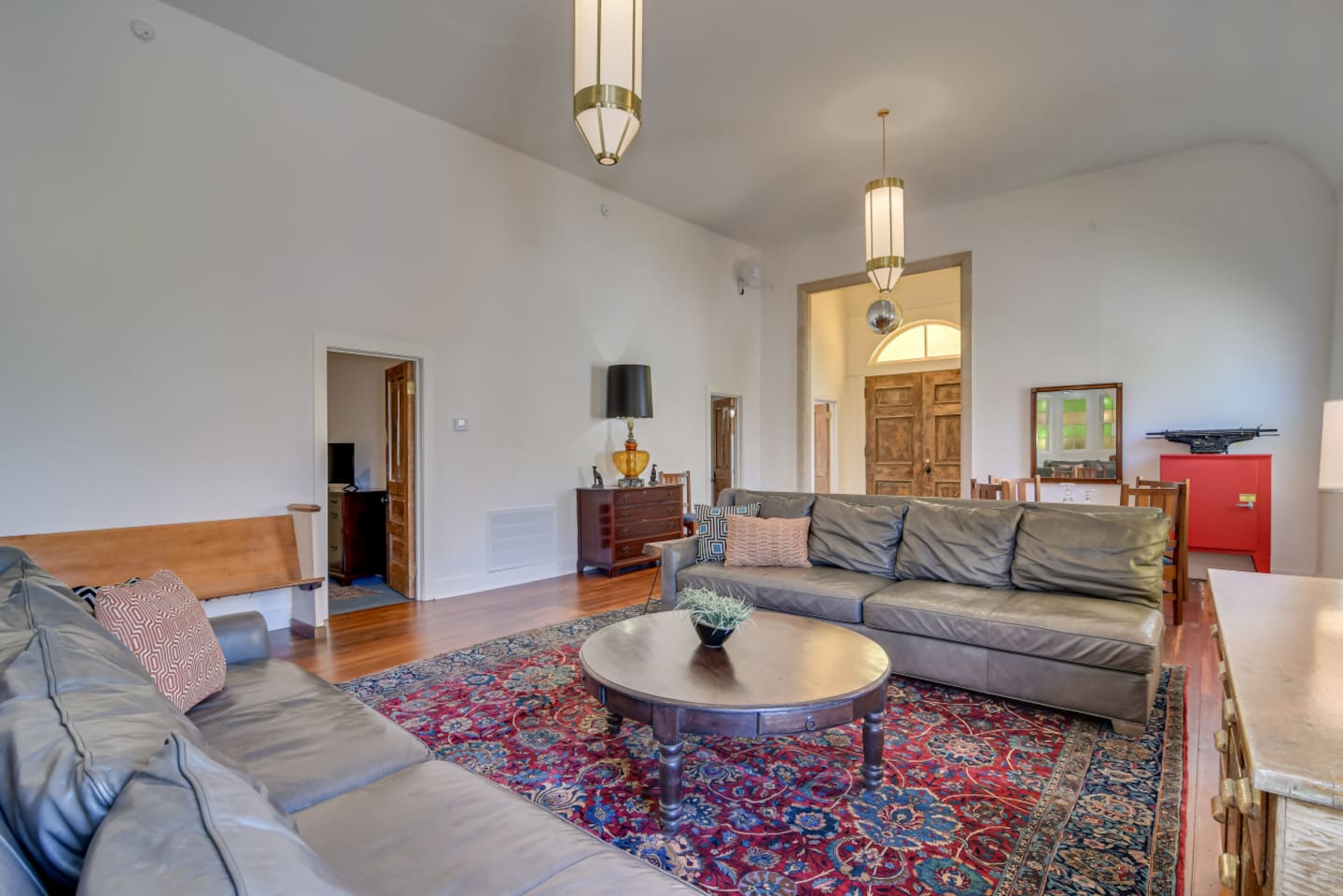 Modern lounge with gray sofas and vaulted ceilings.