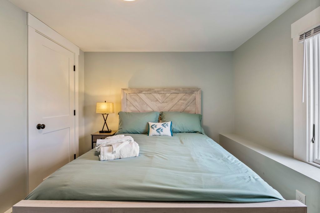 Master bedroom with a comfortable queen-size bed.