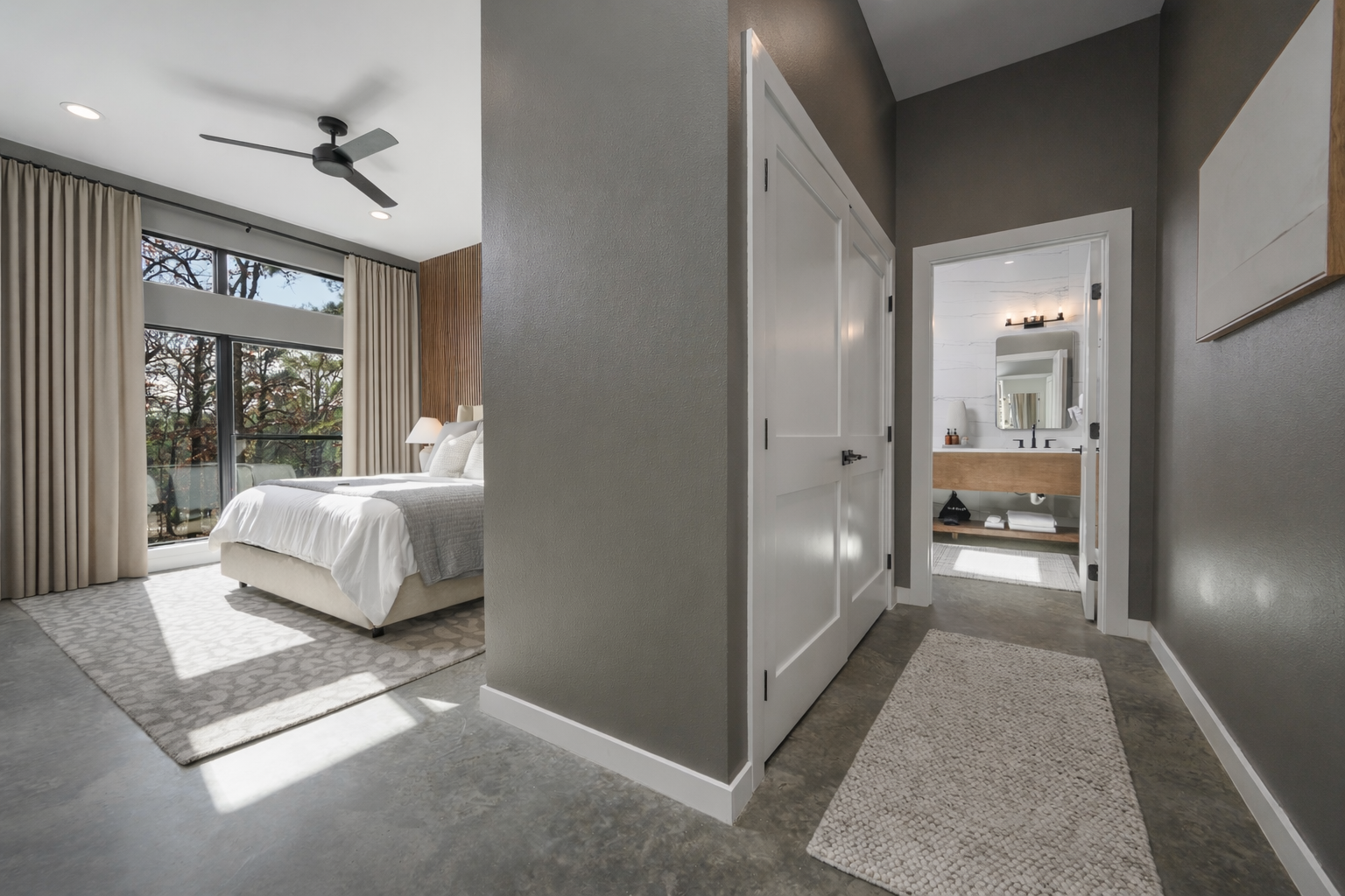 King Suite 1 - Large and spacious suite with teak wood paneling, smart TV, premium king mattress, and luxury bedding. Includes stunning views of the hardwood forest. 