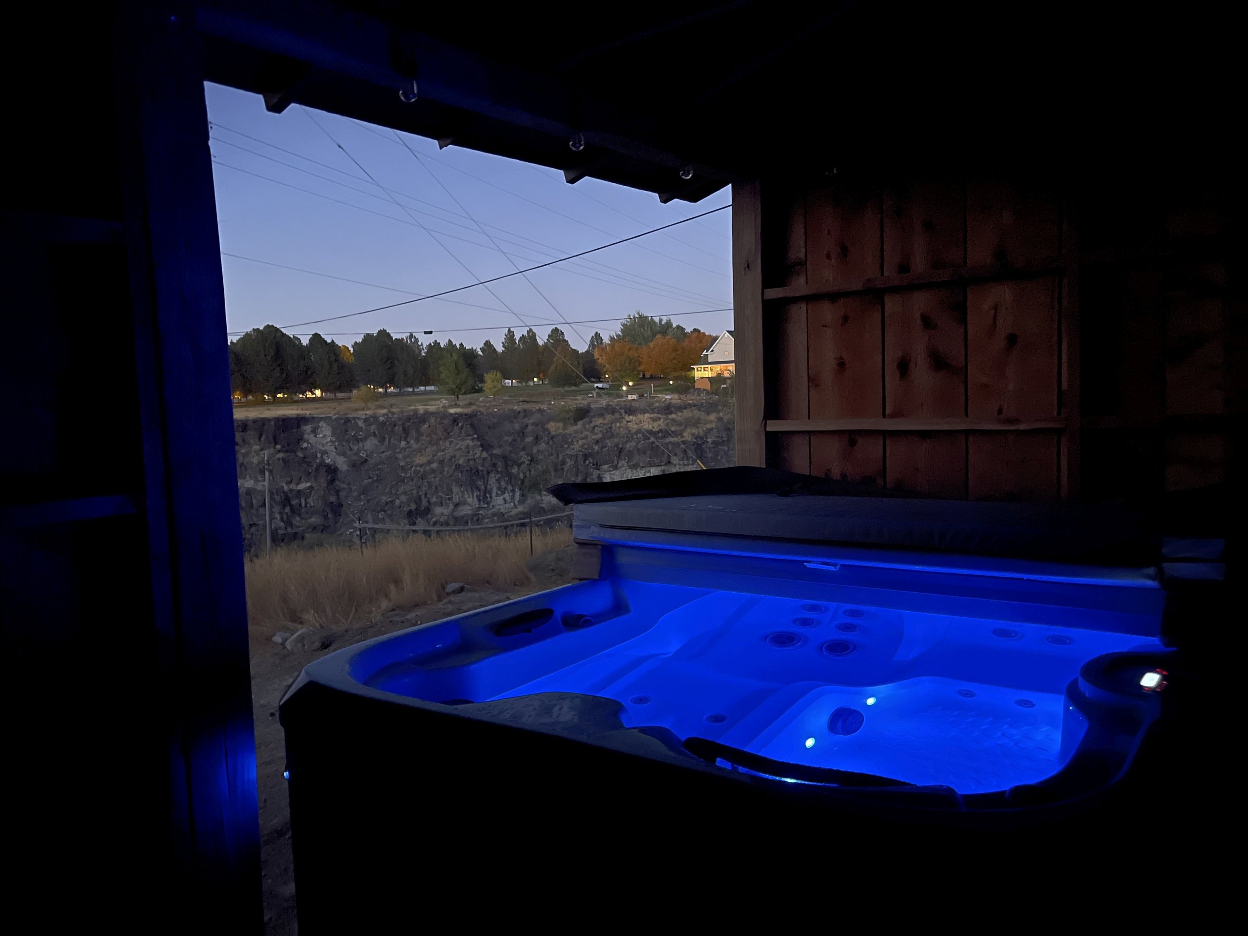 Unwind in the hot tub under the evening sky