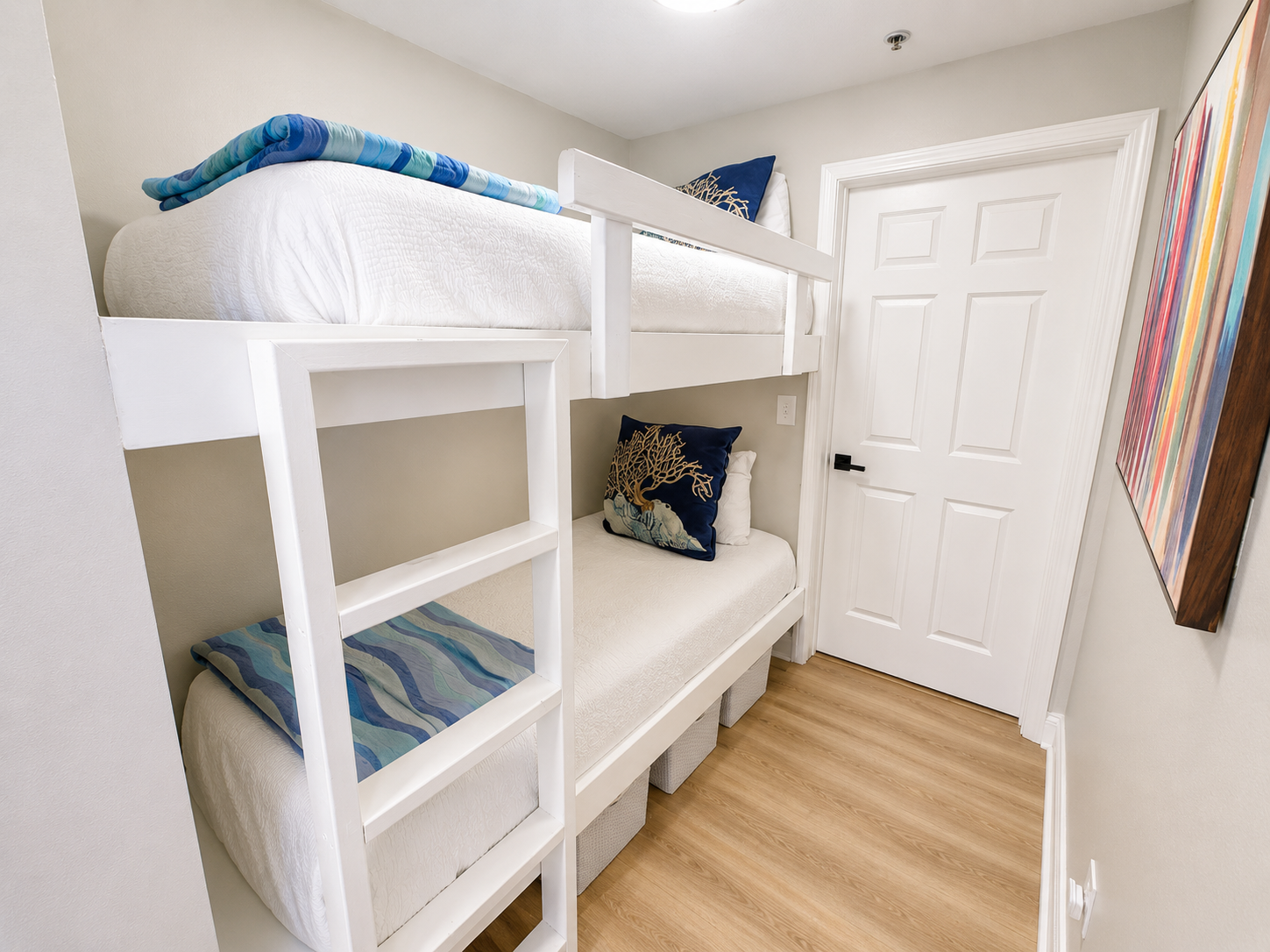 Bunk room with barn door and bathroom access