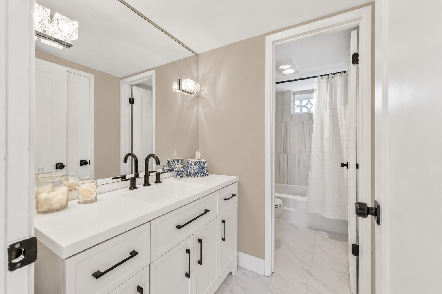 Second bathroom featuring a bathtub and shower.