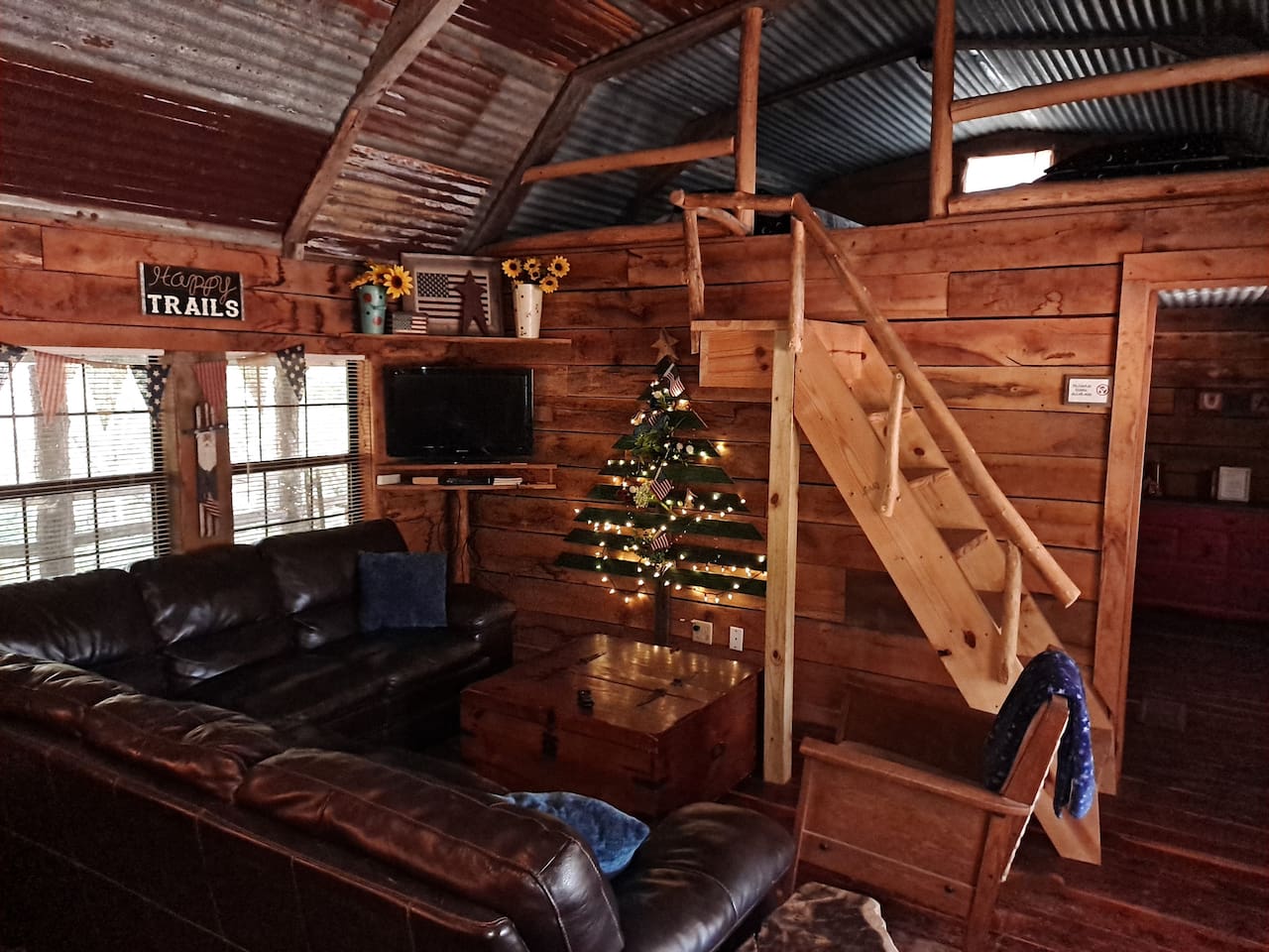 Livingroom area. Loft above has two twin beds.