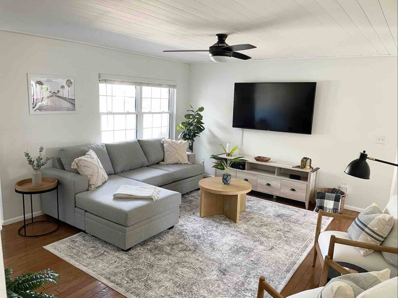 Spacious living room with 65" smart TV to stream any of your accounts.