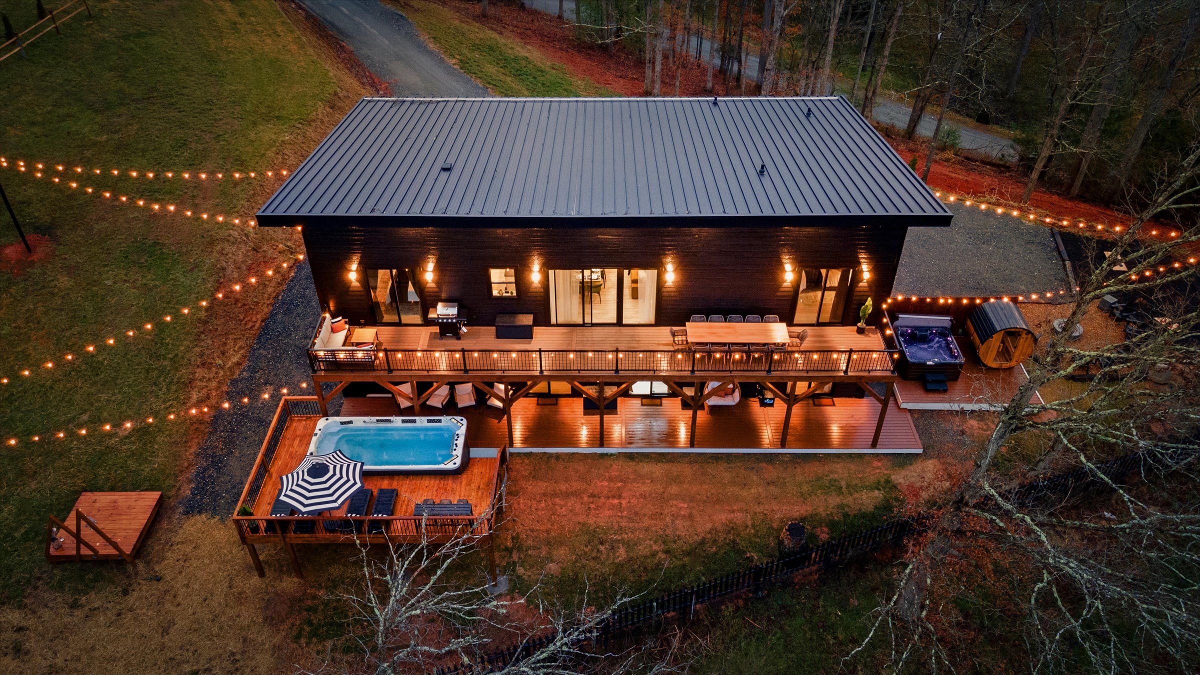 {Summit Exterior}
Set on 2 private acres bordering open farmland, the home offers rare privacy, wide-open views, and the occasional visit from cows along the fence line.