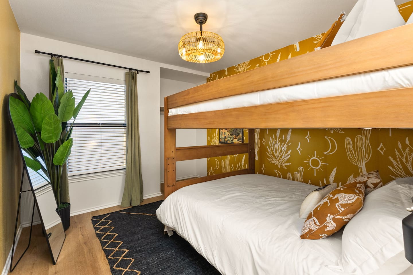 This fun bunk room brings the desert to life with playful wallpaper and cozy vibes-perfect for kids, cousins, or friends traveling together. A great spot to crash after a day at Seaworld, Six Flags, or exploring San Antonio.