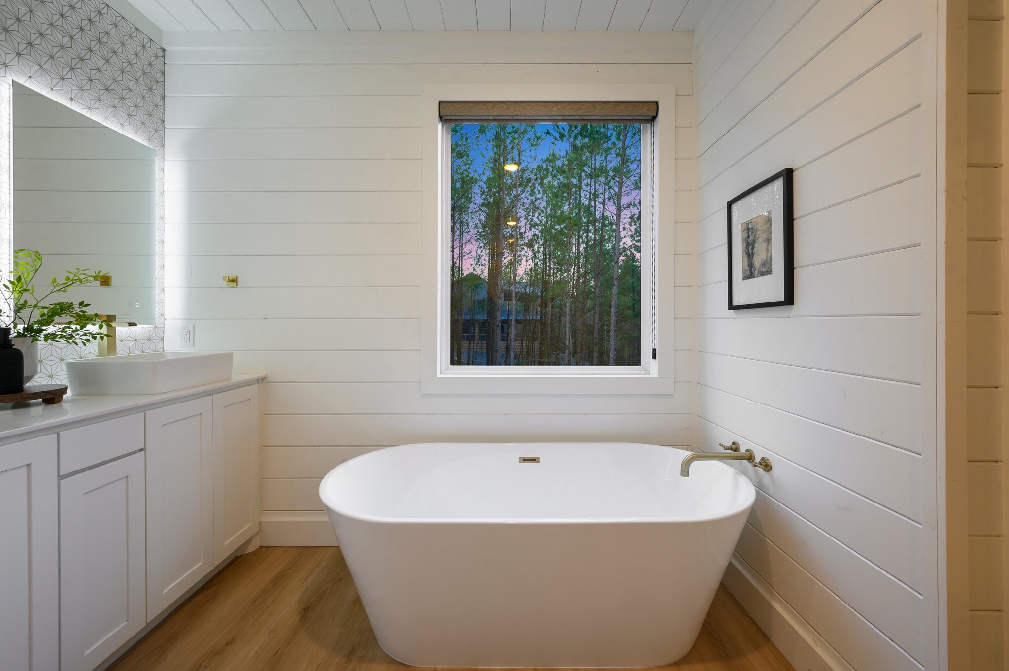 Relax and recharge in the spa-inspired master bath featuring a sleek freestanding soaking tub.