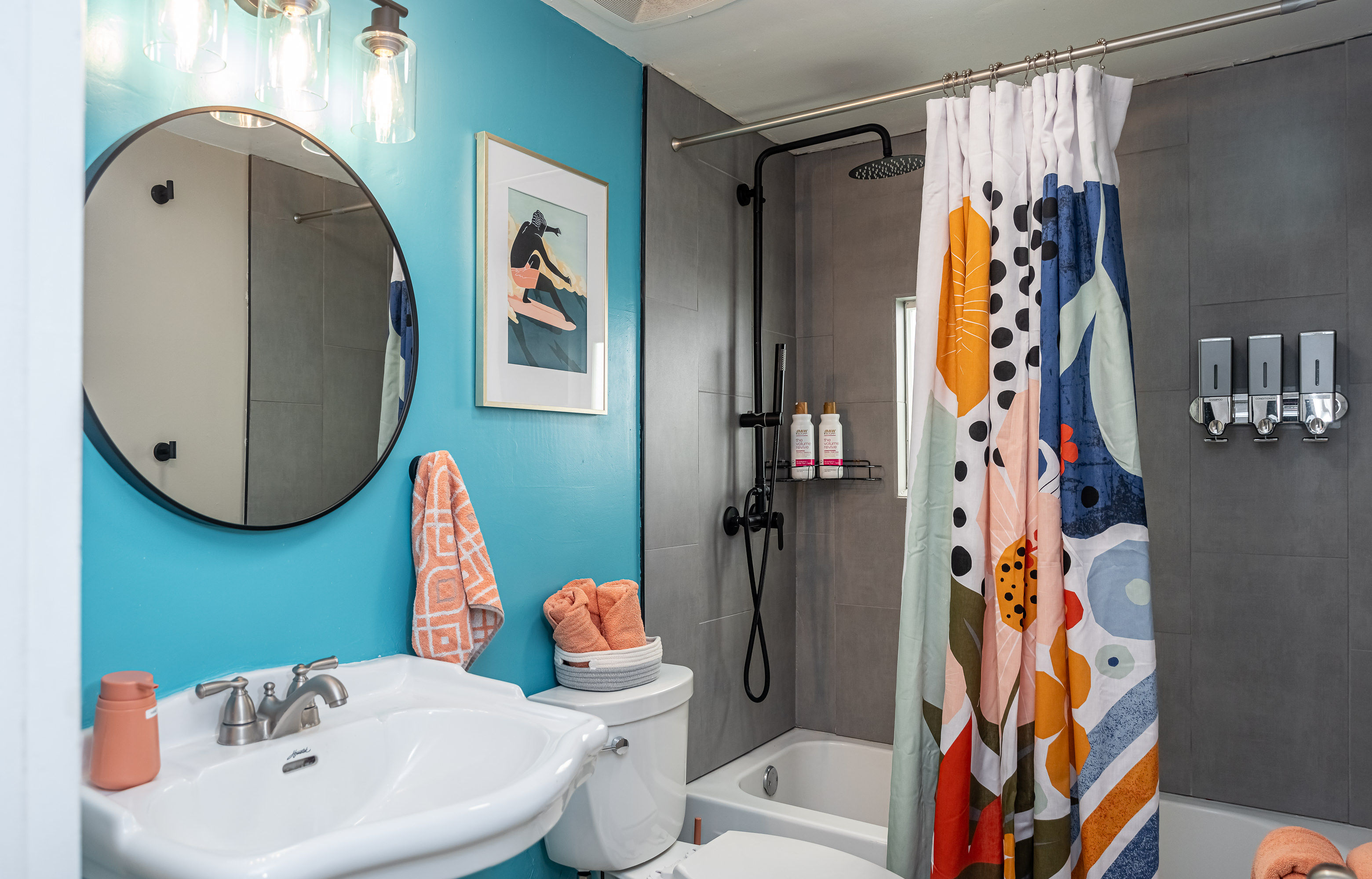 full bathroom with rain shower tub combo