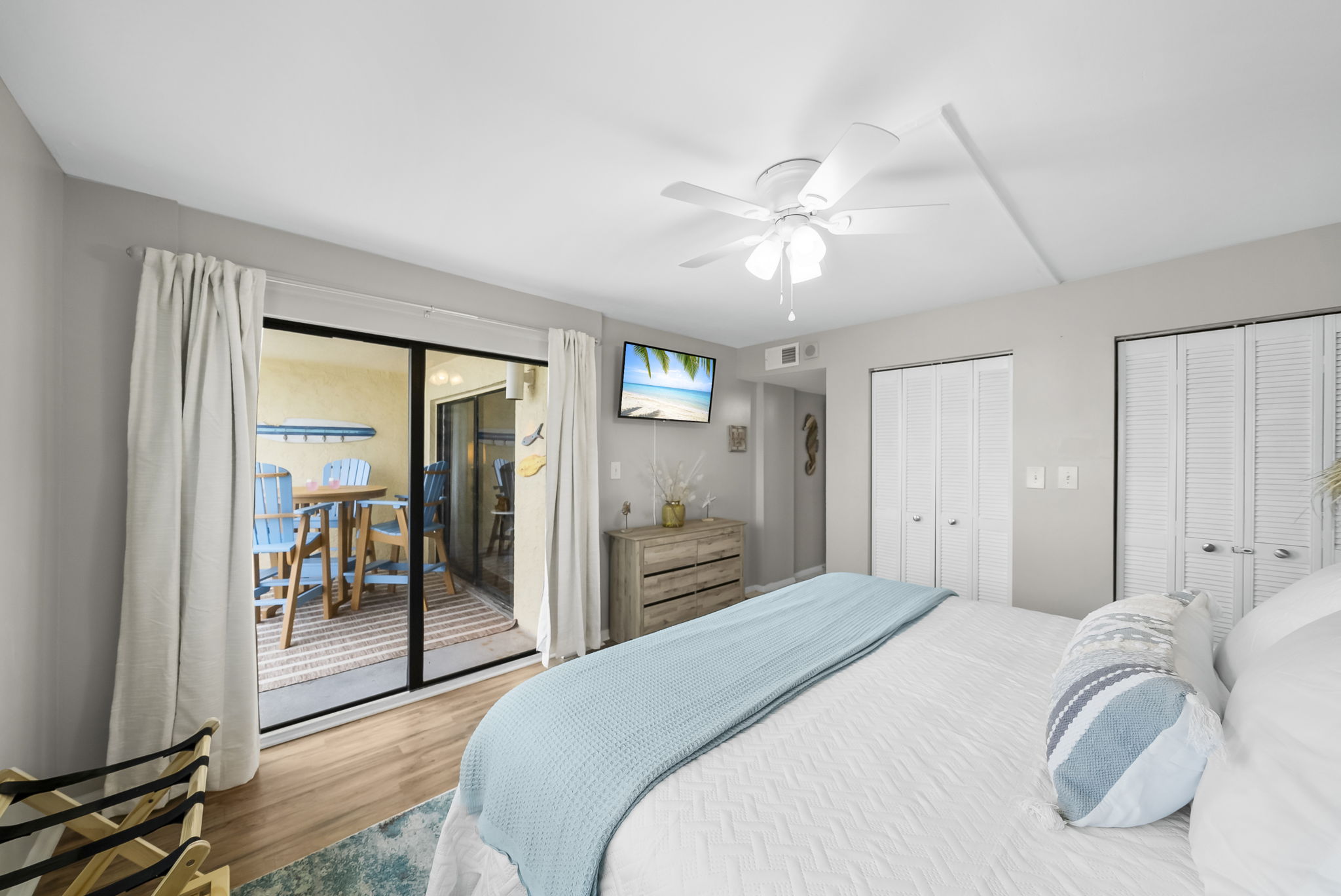 The master suite opens up onto the balcony where you can enjoy a brand new dining set