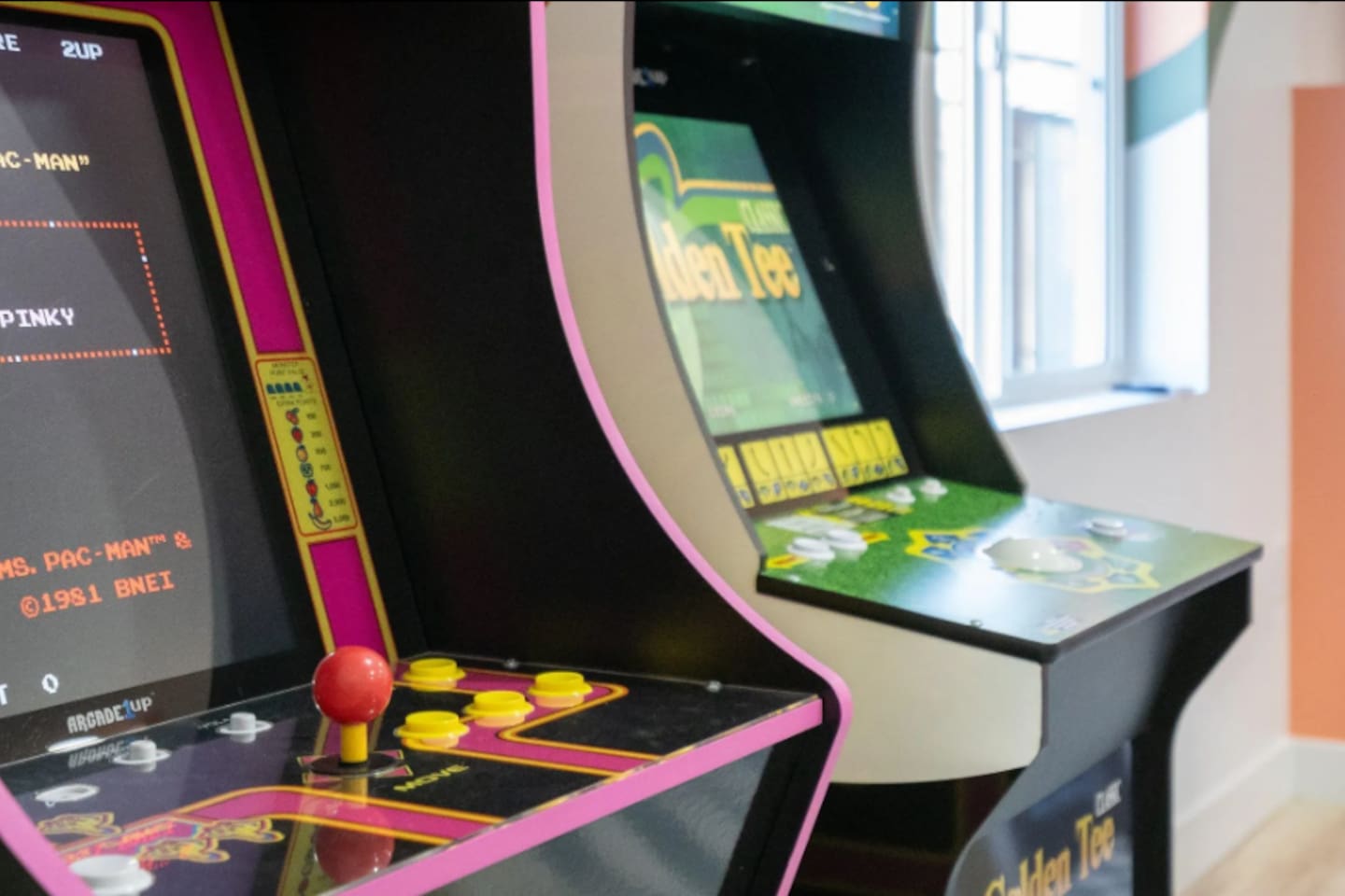 Classic arcade cabinets bring a nostalgic touch, perfect for a little friendly high-score competition.
