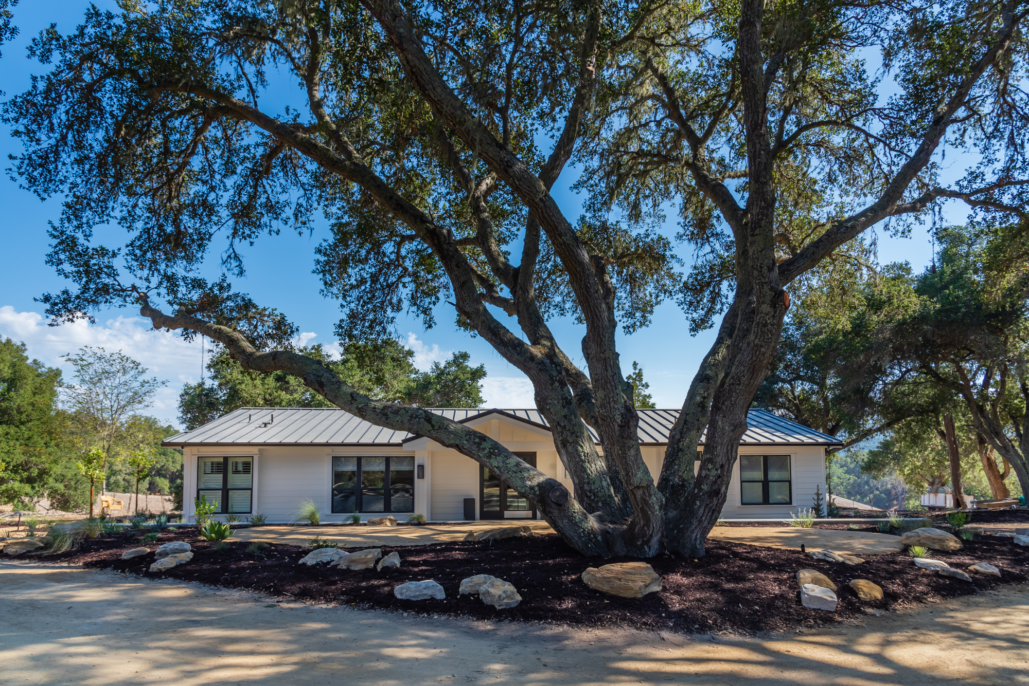 Tucked beneath towering trees, this tranquil haven offers privacy and effortless comfort.