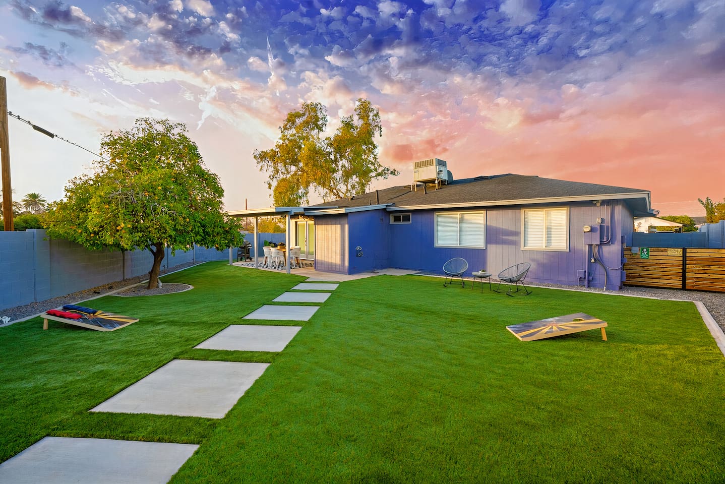 Huge back yard with soft artificial turf.