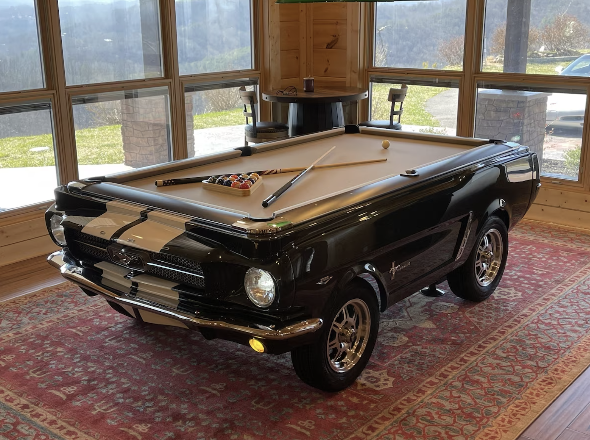 The first thing you'll see upon entering the Chalet is our custom Ford Mustang billiards table.