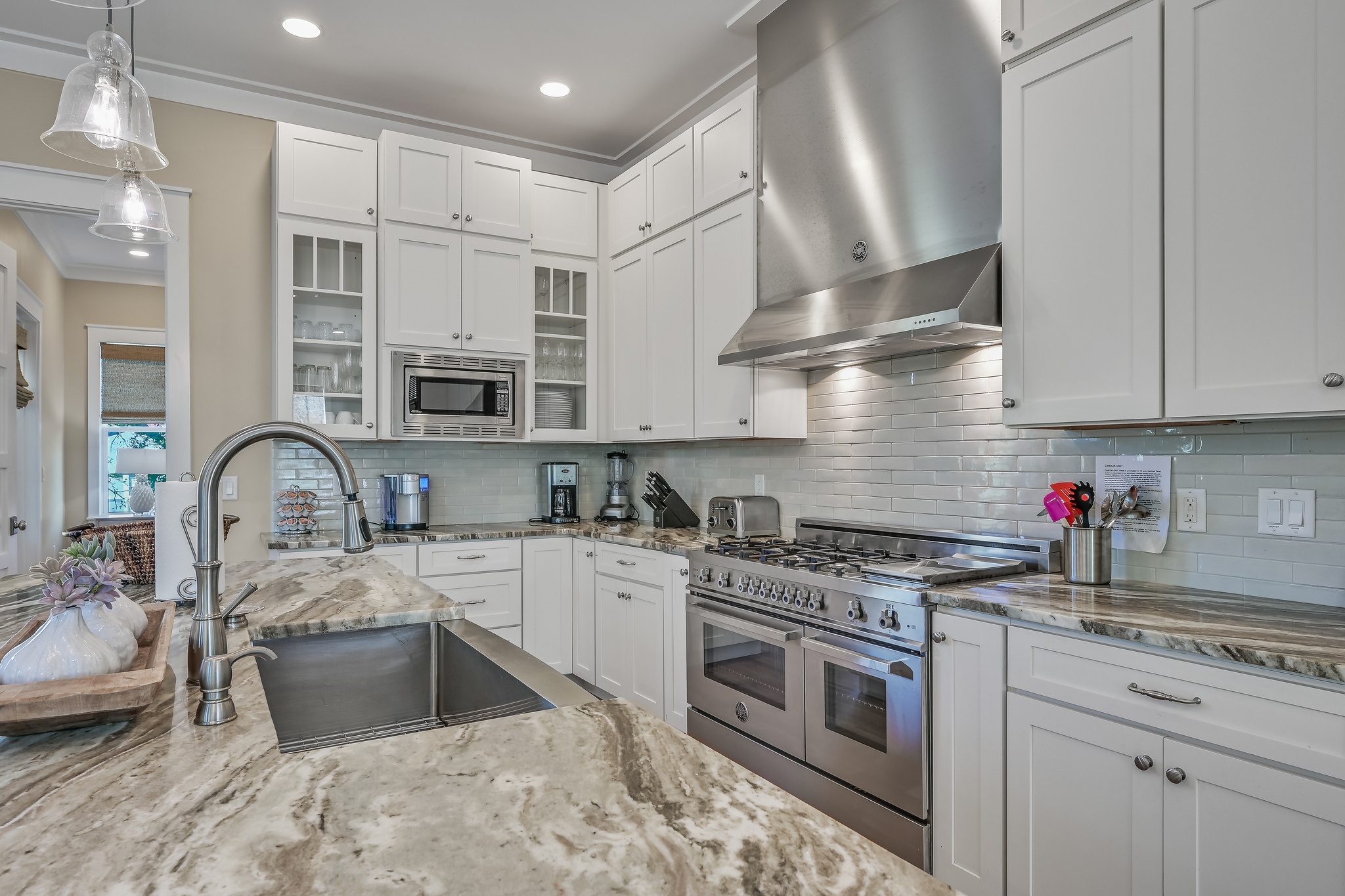 Beautiful 48" gas range provides 6 burners, a griddle, and two ovens.