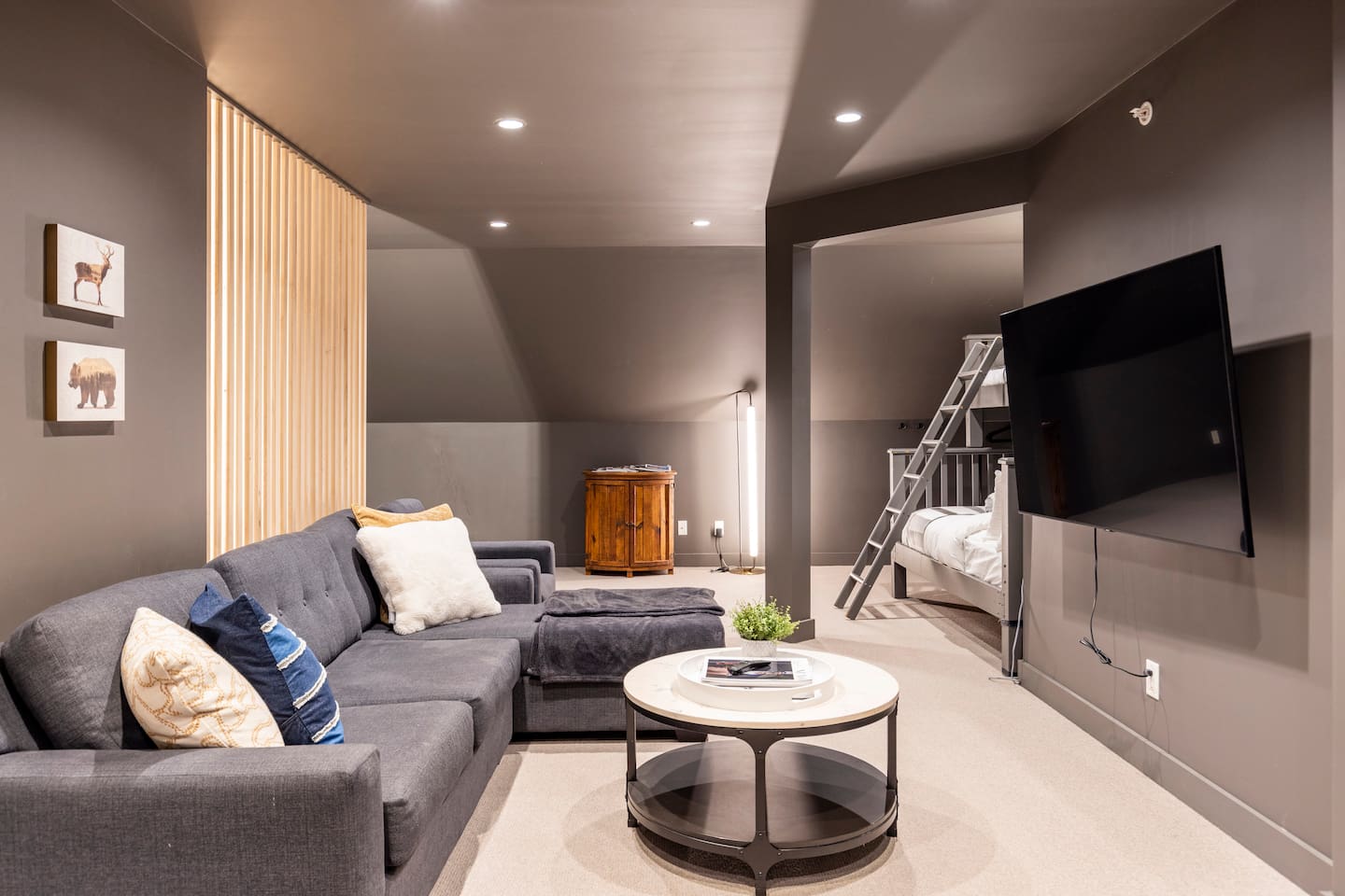 Media room upstairs. Single over queen bunk beds in the nook.
