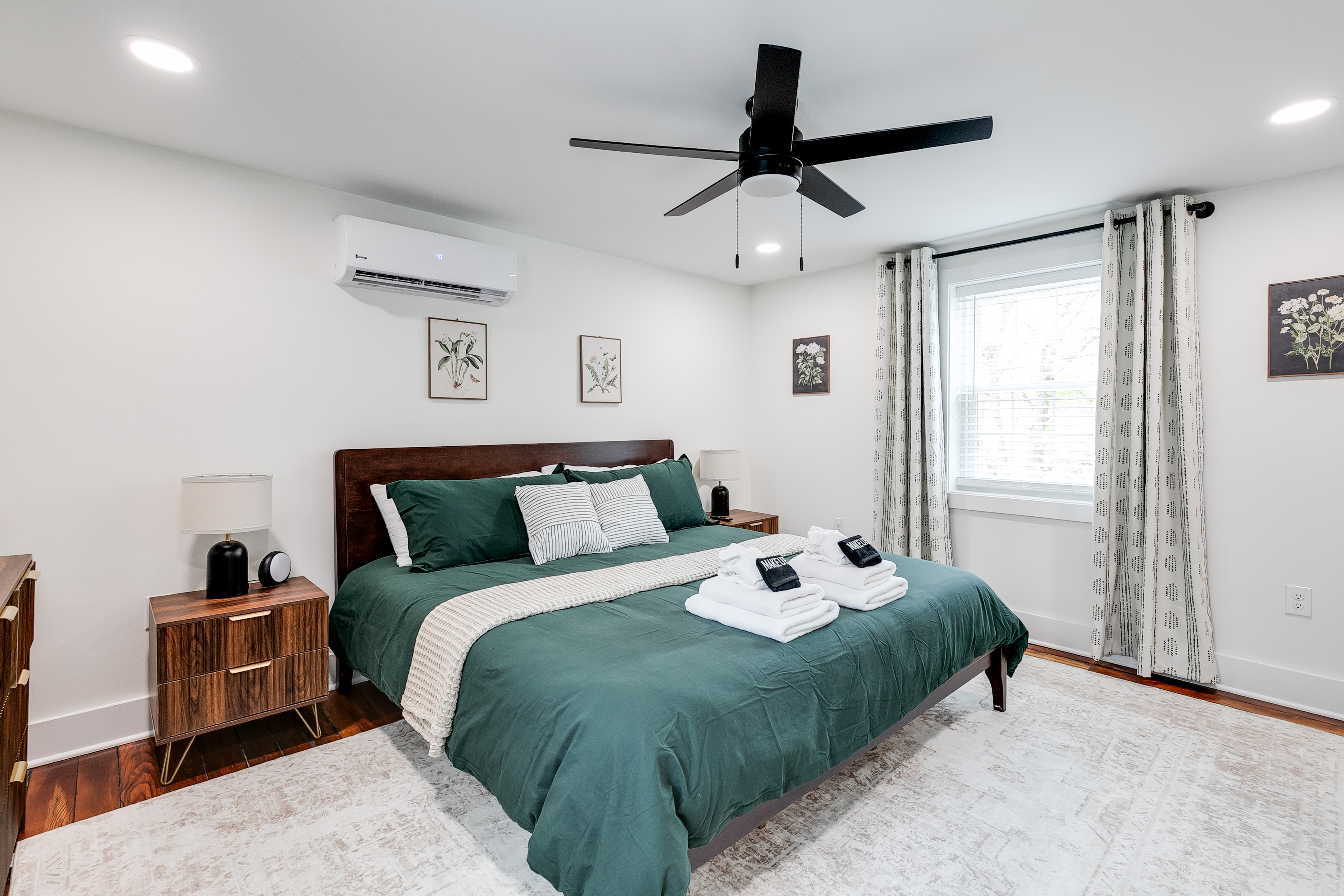 Serene Retreat: Enjoy a queen bed, stylish decor, and natural light in this tranquil bedroom!