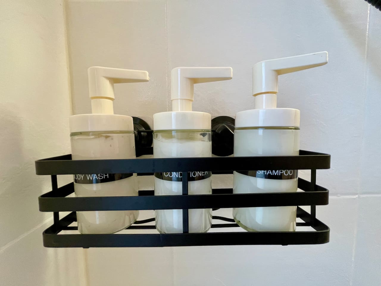 Complimentary bathroom essentials provided, including shampoo, conditioner, and body wash.