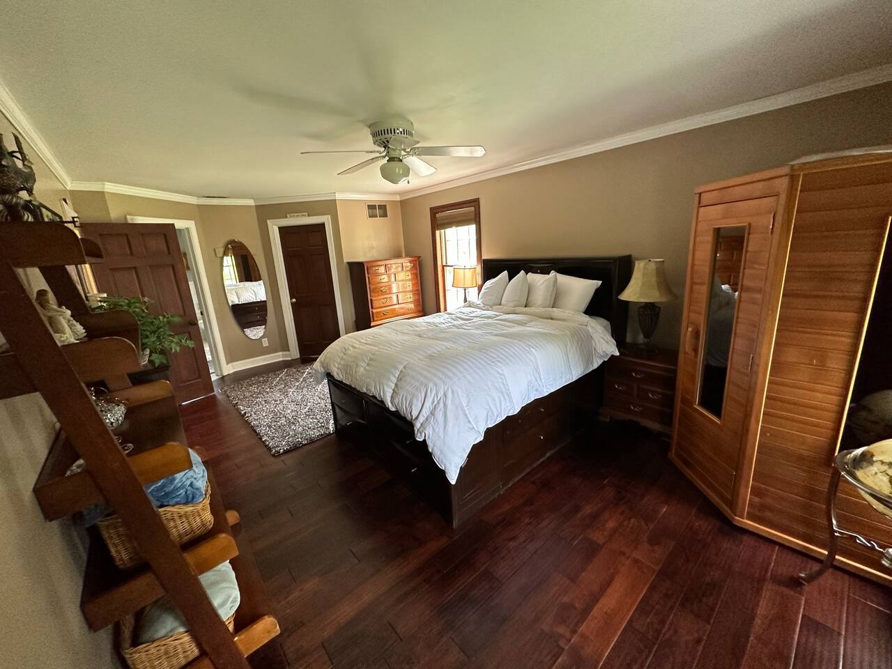 Master bedroom (BR1) with Queen Bed. The wood enclosure is a working Suana.