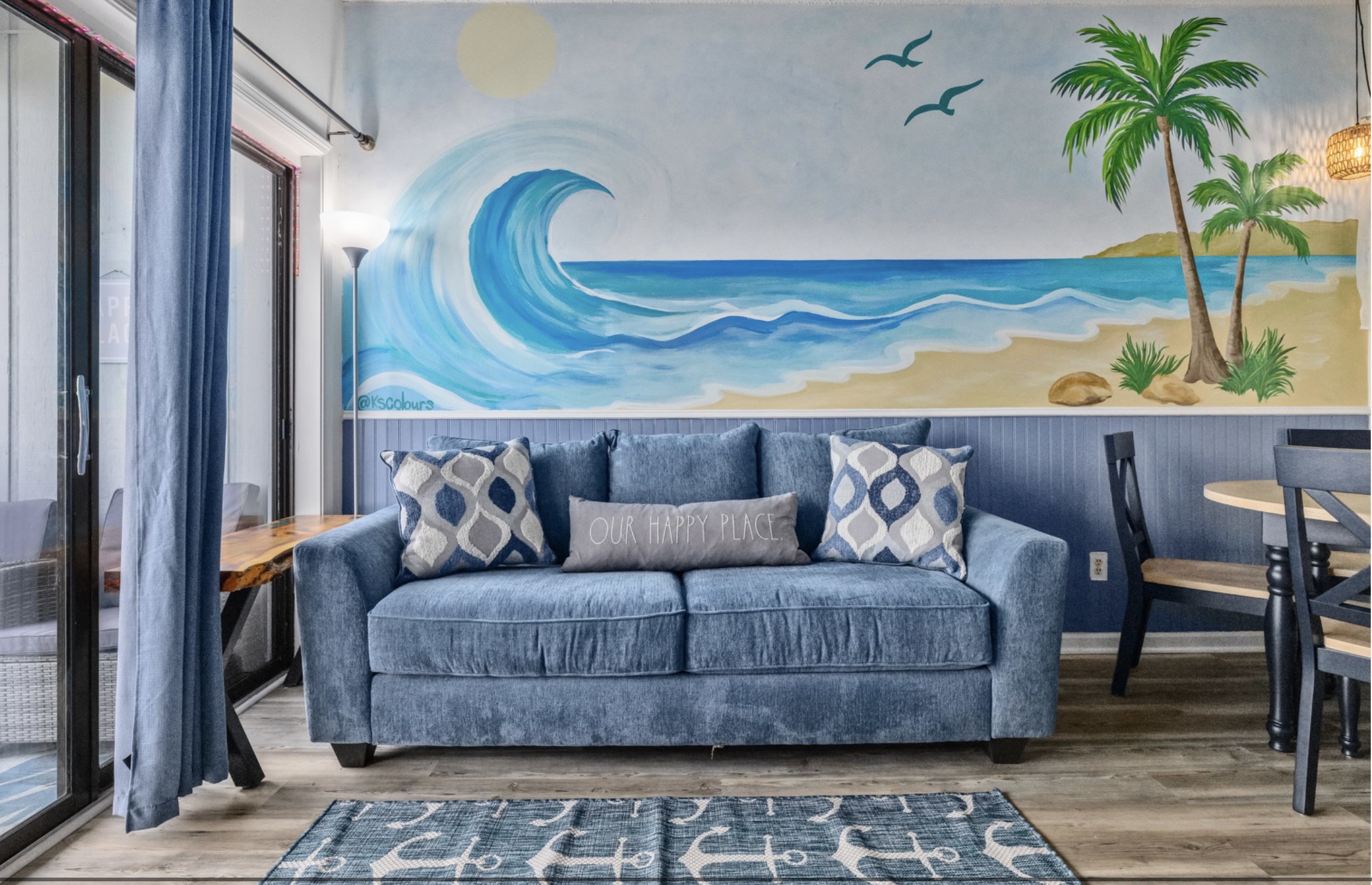Sink into coastal comfort beneath a hand-painted ocean mural 🌊
Plush lounge seating, calming beach tones, and a space designed to unwind, reconnect, and fully slip into vacation mode.