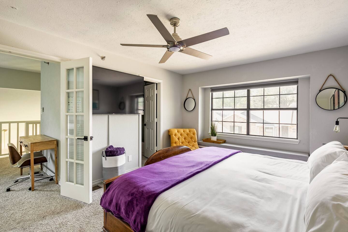 Spacious bedroom with king bed and a work space right outside