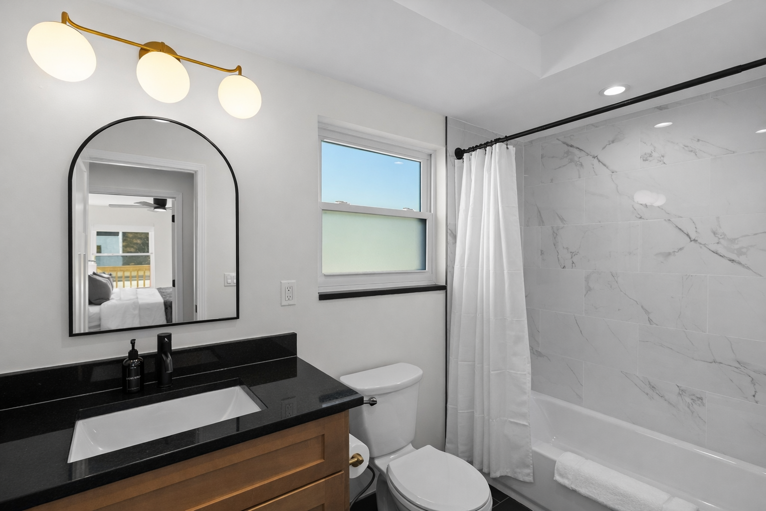 Bright, modern bathroom with a sleek vanity, spa-like shower, and elegant finishes—designed for a refreshing, relaxing start or end to your day