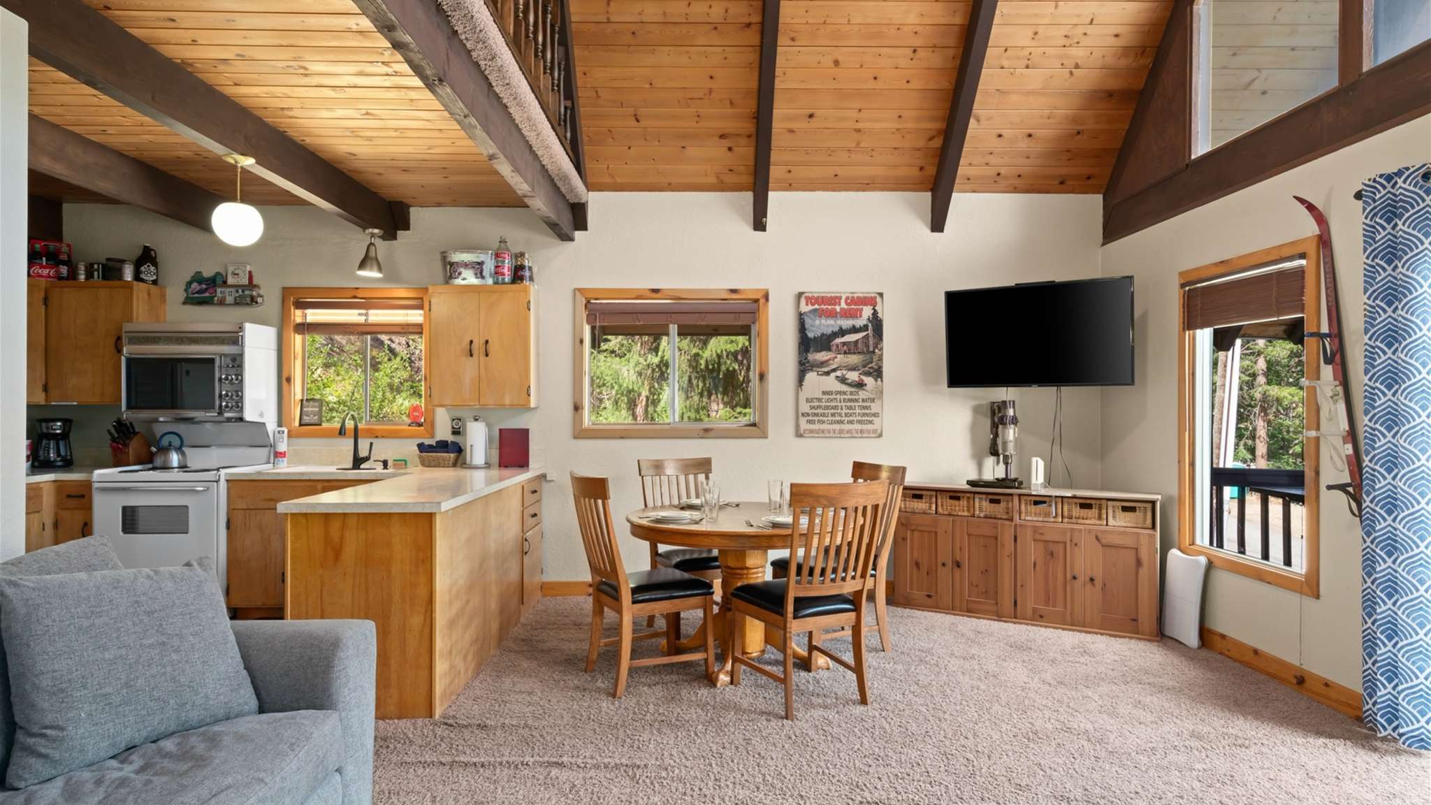 Vaulted ceilings and open-concept layout make the space feel bright and airy.