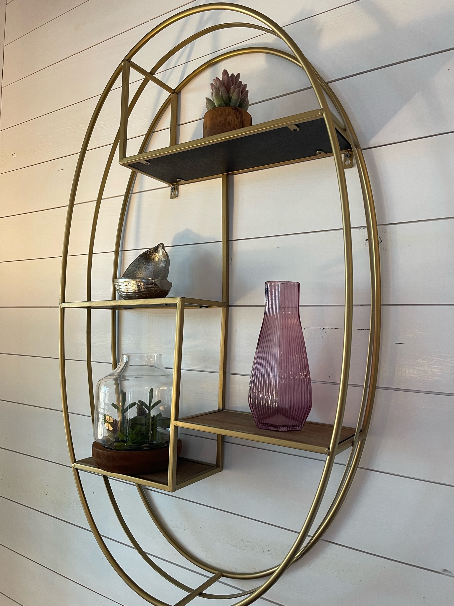 Living room decor on the modern and fresh white shiplap walls.