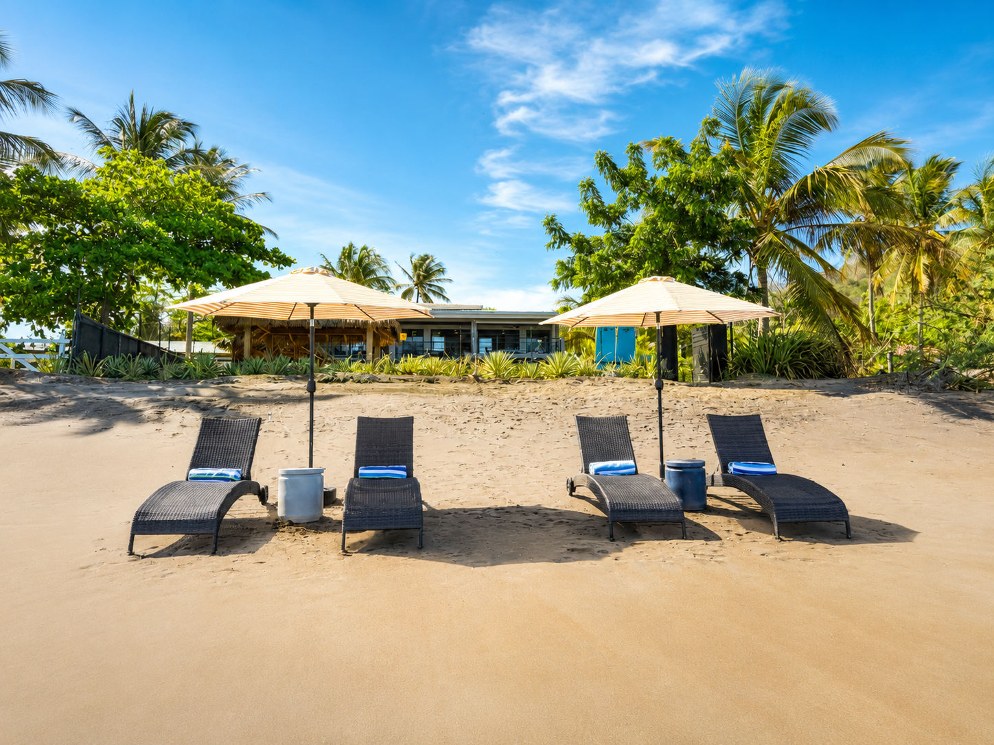 Lounge on sand directly in front of the villa 