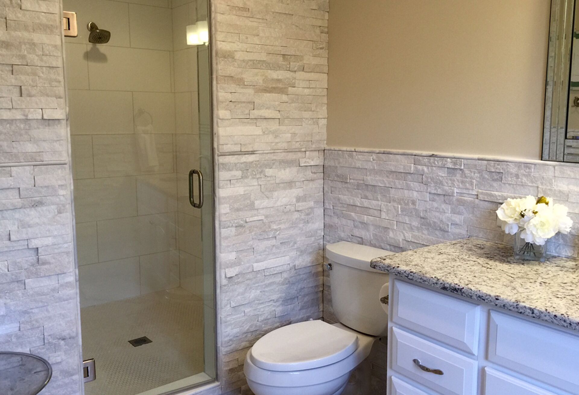 Double queen bedroom has private bath with large shower stall.