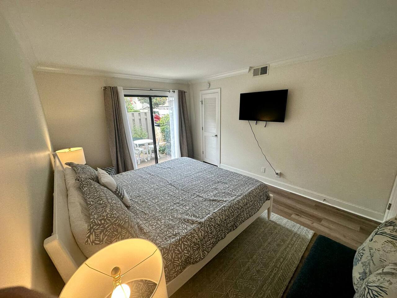 Bedroom with wall-mounted TV
