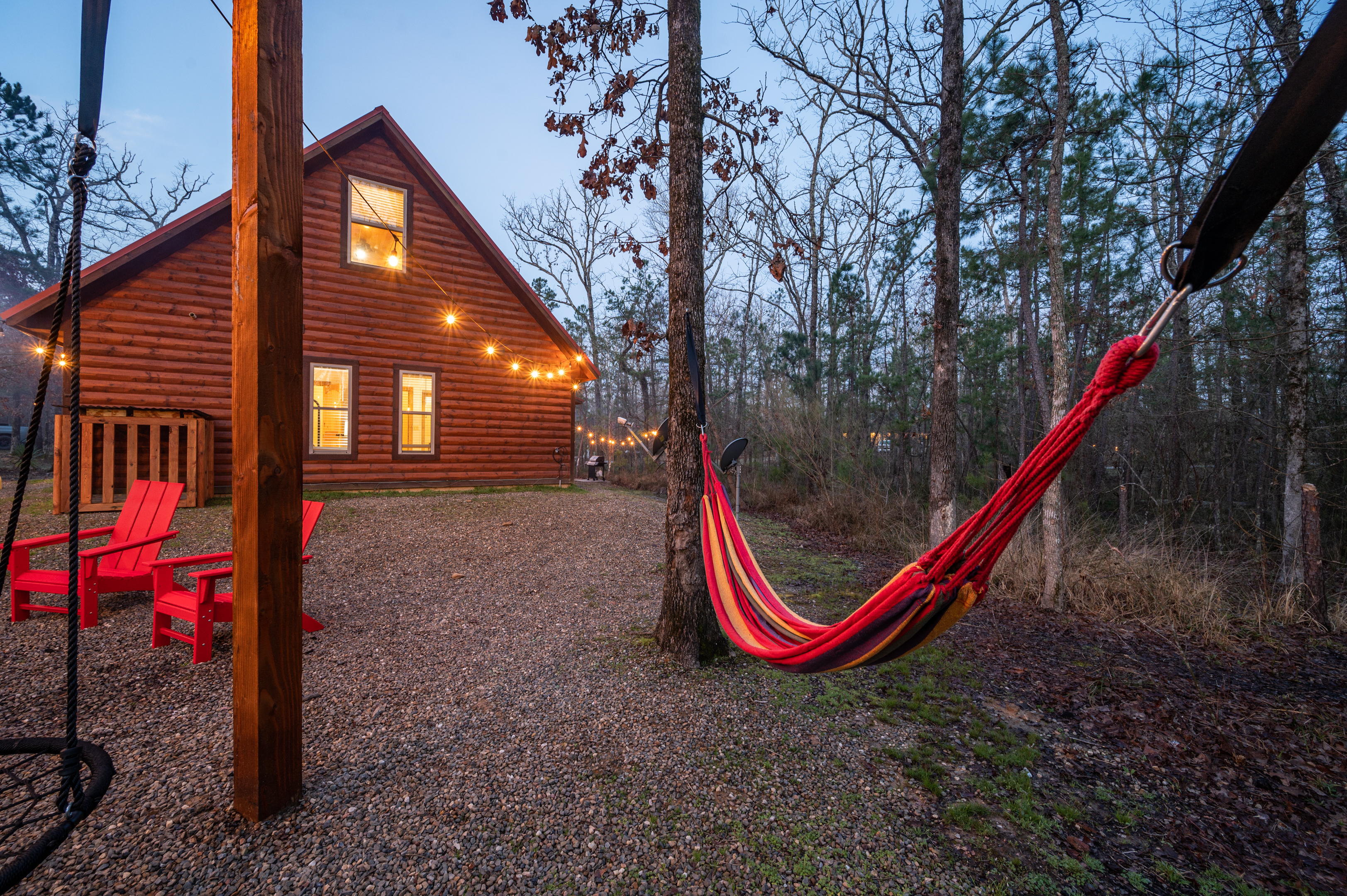 Relax and unwind in our cozy hammock by the fire pit - where every sway brings serenity and every flame adds warmth to your retreat