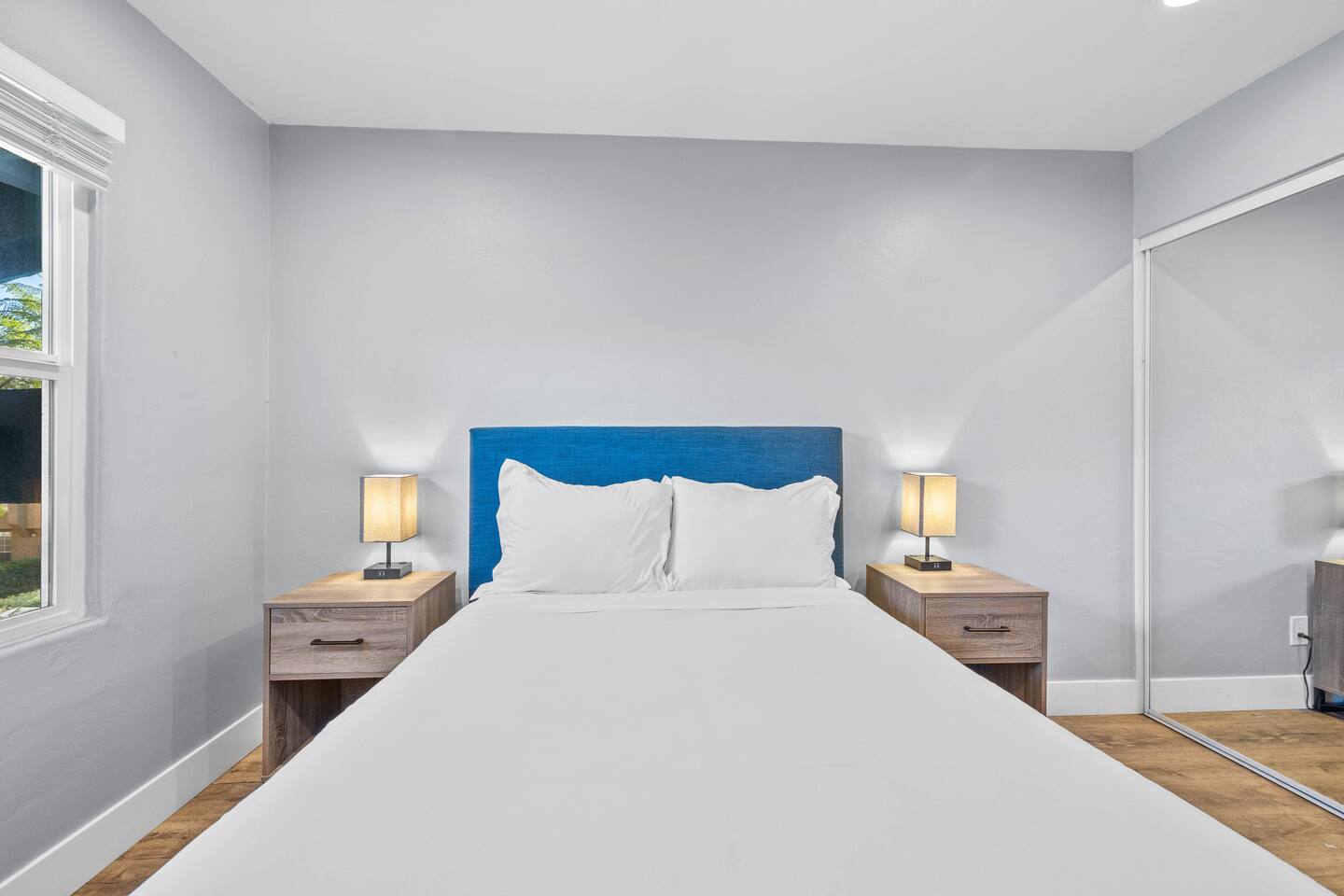 Stay in style with a comfortable bed, and elegant lamp, in this inviting bedroom. A charming retreat designed for both comfort and relaxation!