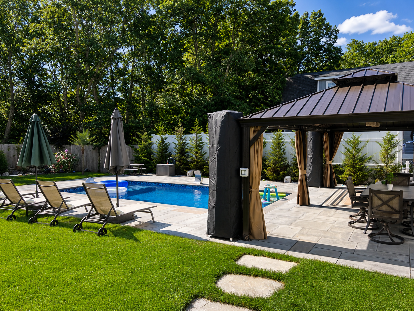 Sun-drenched pool patio with loungers and umbrellas