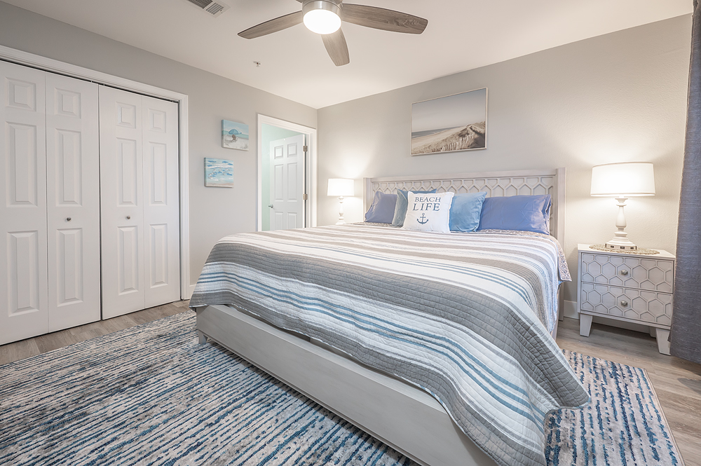 King bed, bedside lamps with USB and AC power outlets.