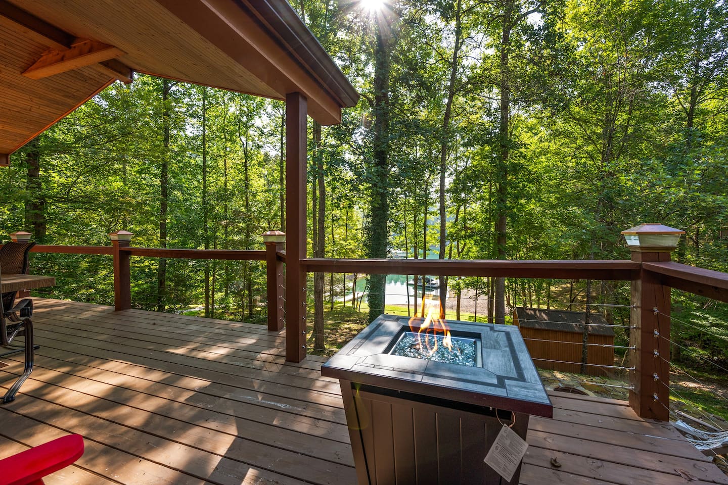 Gas firepit located on upper back deck