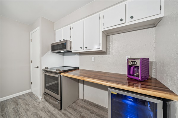 The kitchen features a 30 plus inch work space with 34" counter height for greater accessibility. There is an accessible mini-fridge under the counter.