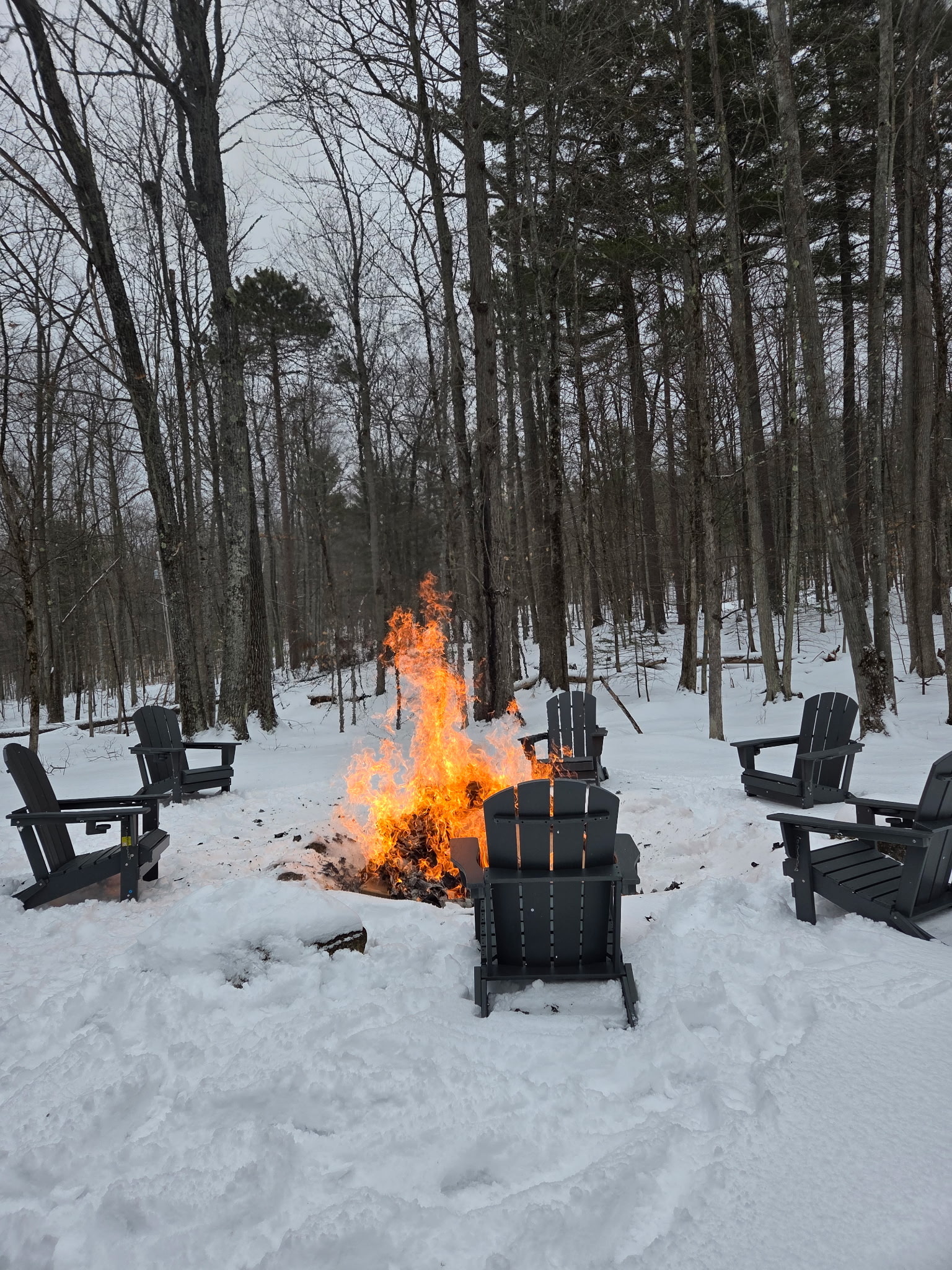 Enjoy some s'mores with our outdoor fire pit surrounded by Adirondack chairs