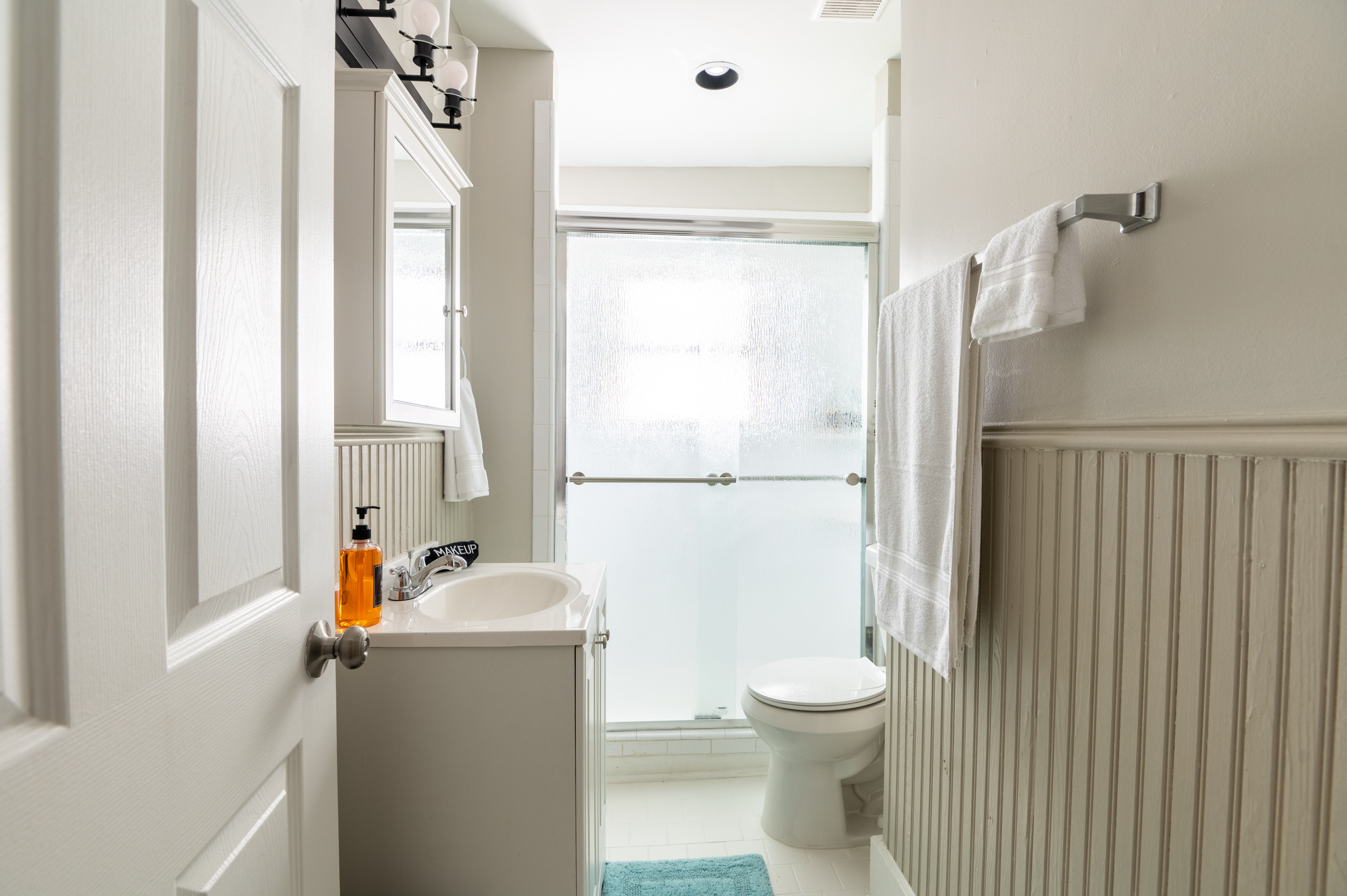 Fresh and Modern: Our elegantly designed bathroom features a luxurious walk-in shower with contemporary fixtures.