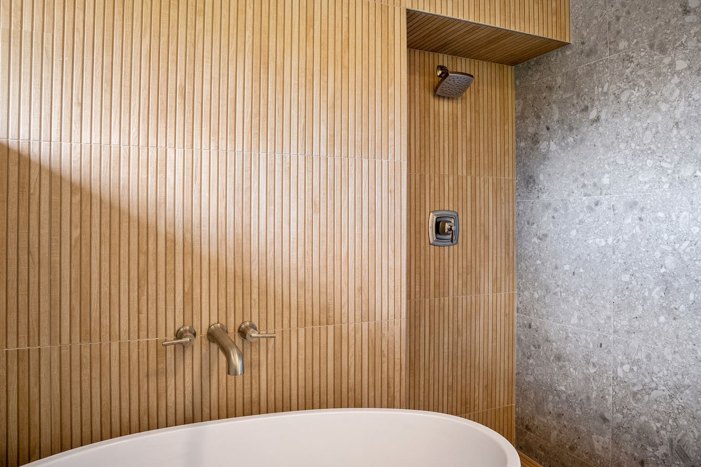 This bathroom has a tile shower and separate 52" soaking bathtub.