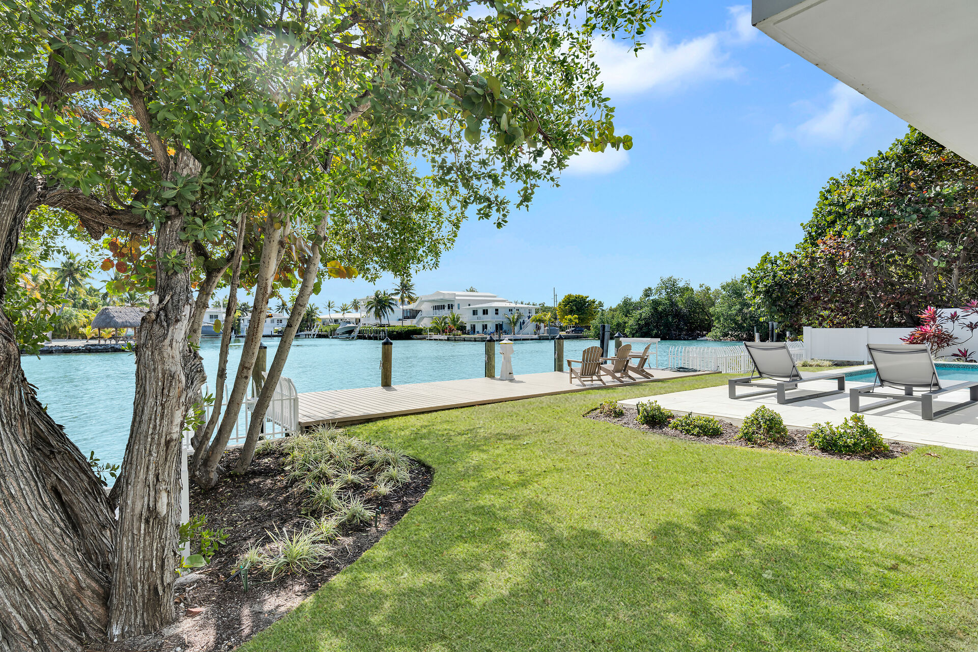 Back yard with pool and dock.