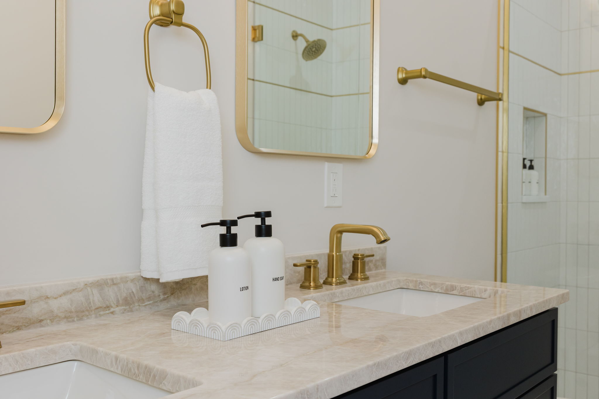Ensuite primary bathroom with double vanity and luxury amenities to get ready for your day!