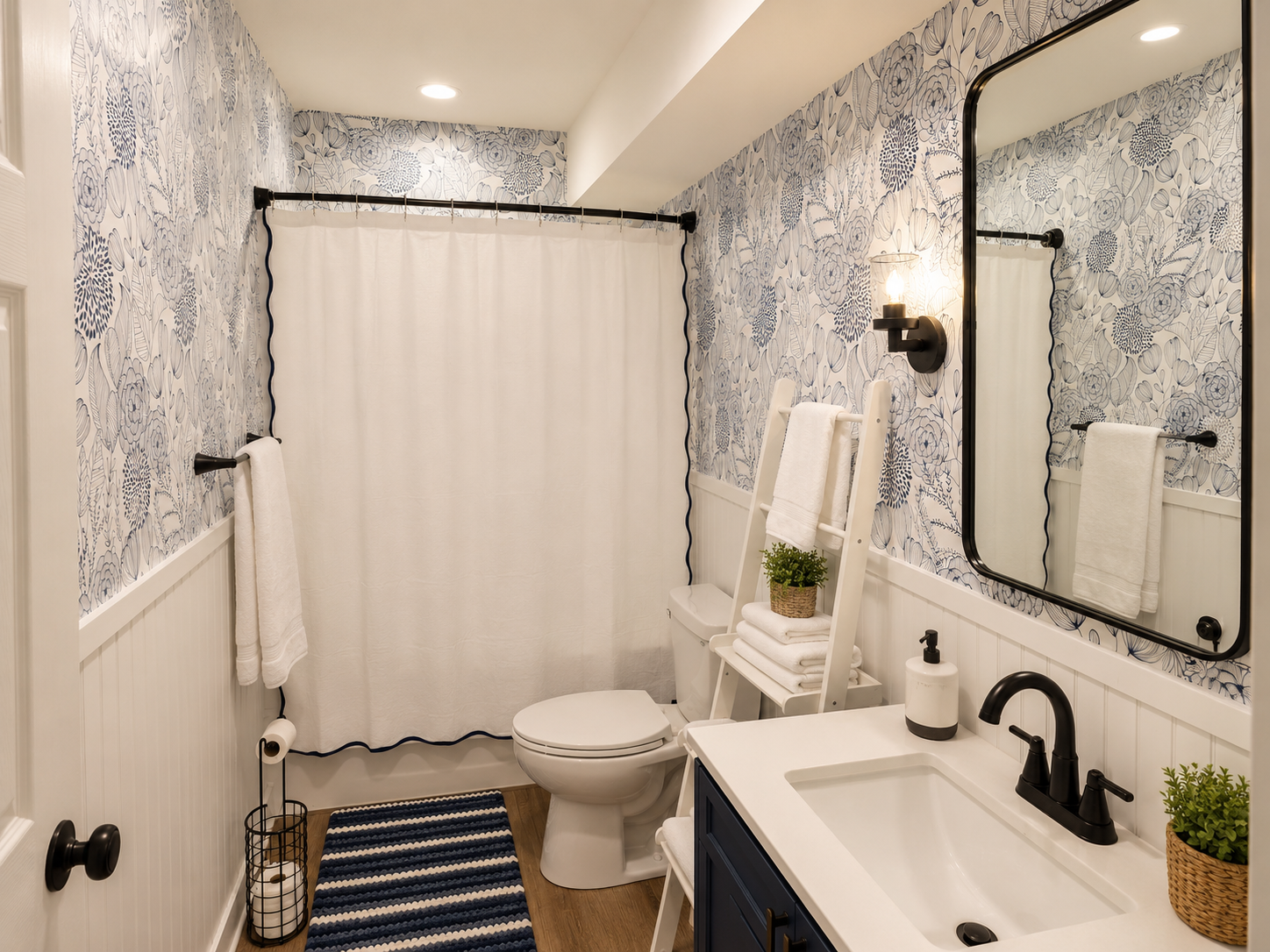 Main-floor bathroom with tub/shower combo, stocked essentials and convenient access from the nearby bedroom and hallway.