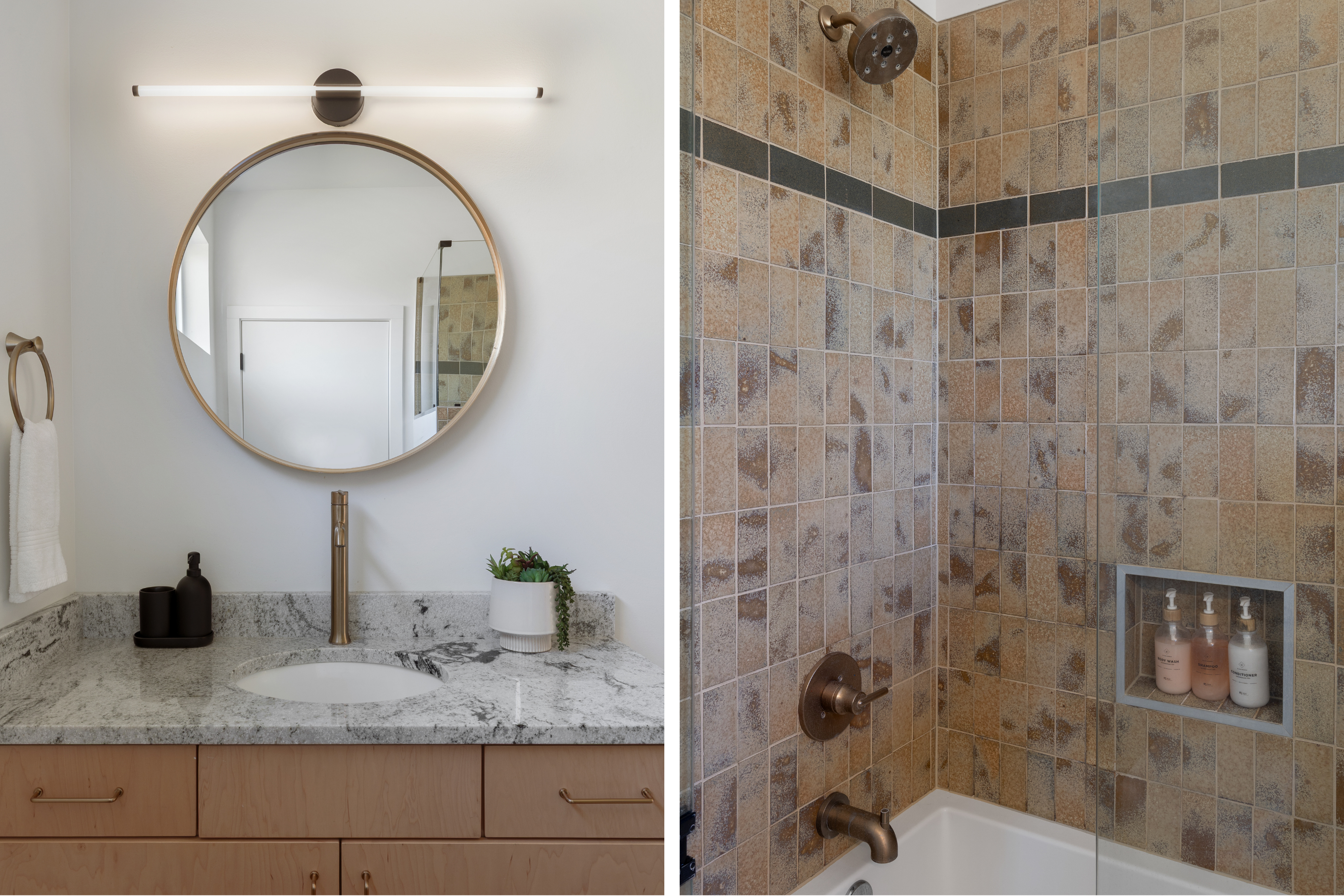 {Primary Ensuite Bath} A serene walk-in shower with earthy tones, bronze fixtures, and premium Public Goods toiletries—your perfect reset after a day exploring Asheville.