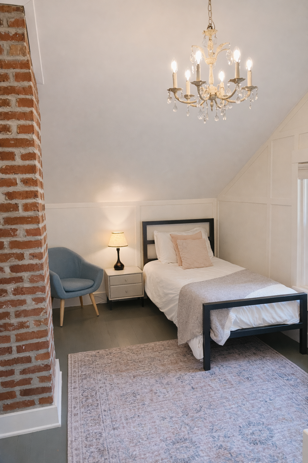 This cozy bedroom features two comfortable twin beds, making it a great space for kids, friends, or additional guests. Thoughtfully furnished for a restful night's sleep, it offers a comfortable and inviting place to recharge after a day of exploring Napa